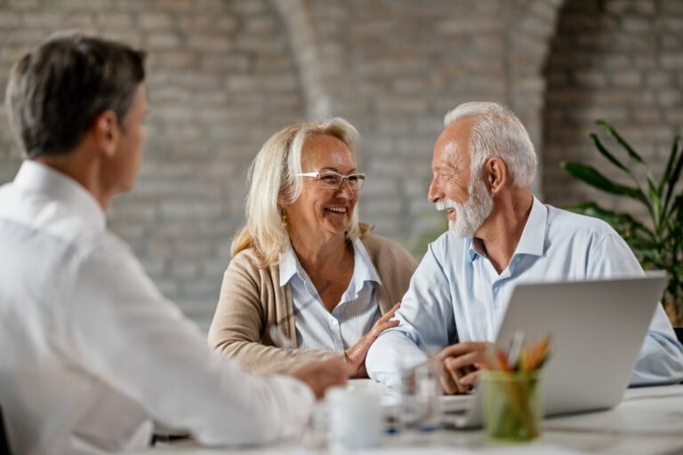 happy-senior-couple-talking-to-each-other-while